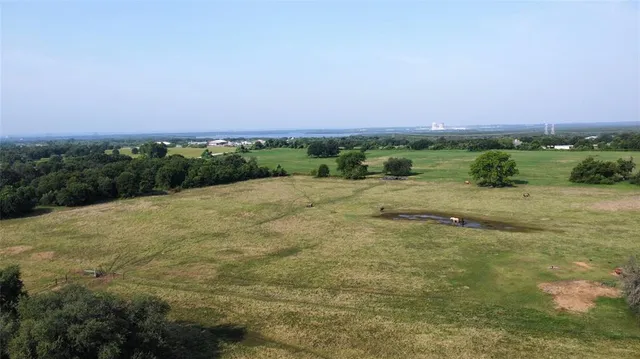 a view of a lake with a yard