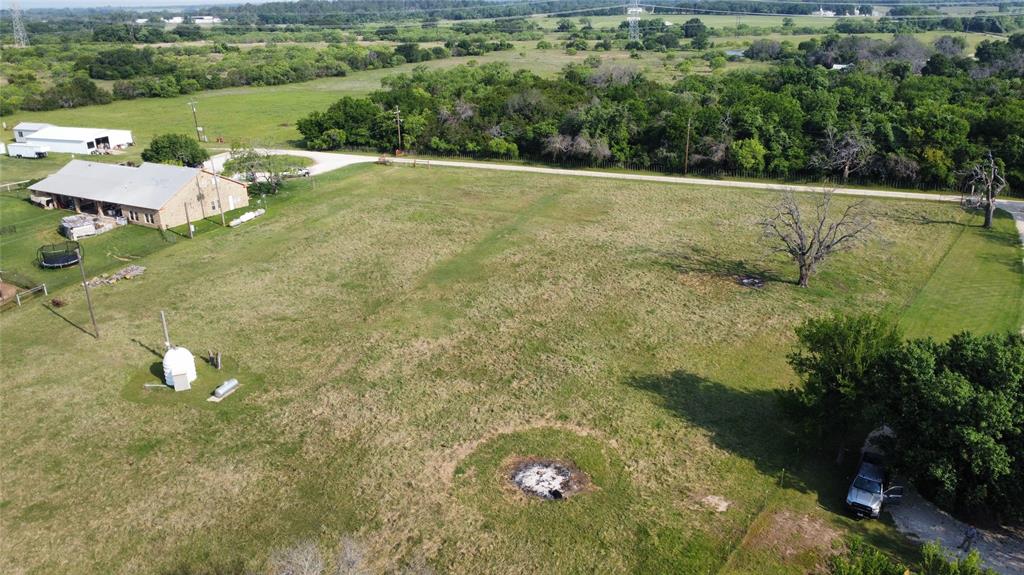 9600 Nubbin Ridge Court Granbury, TX 76048 - Photo 7 of 10 a view of a tree with a yard