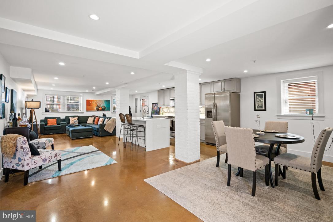 1239 Simms Place Northeast, Unit 5 Washington, DC 20002 - Photo 1 of 31 a living room with furniture and a table