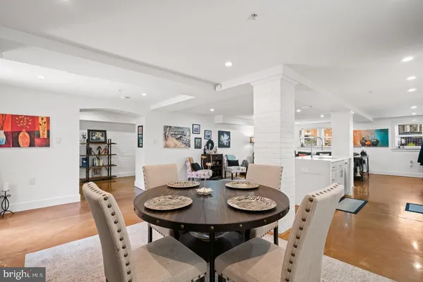 a view of a dining room with furniture and wooden floor