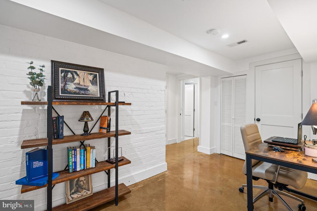 1239 Simms Place Northeast, Unit 5 Washington, DC 20002 - Photo 15 of 31 a view of a workspace with furniture and a window