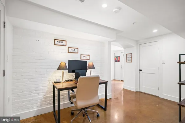 a workspace with furniture and wooden floor