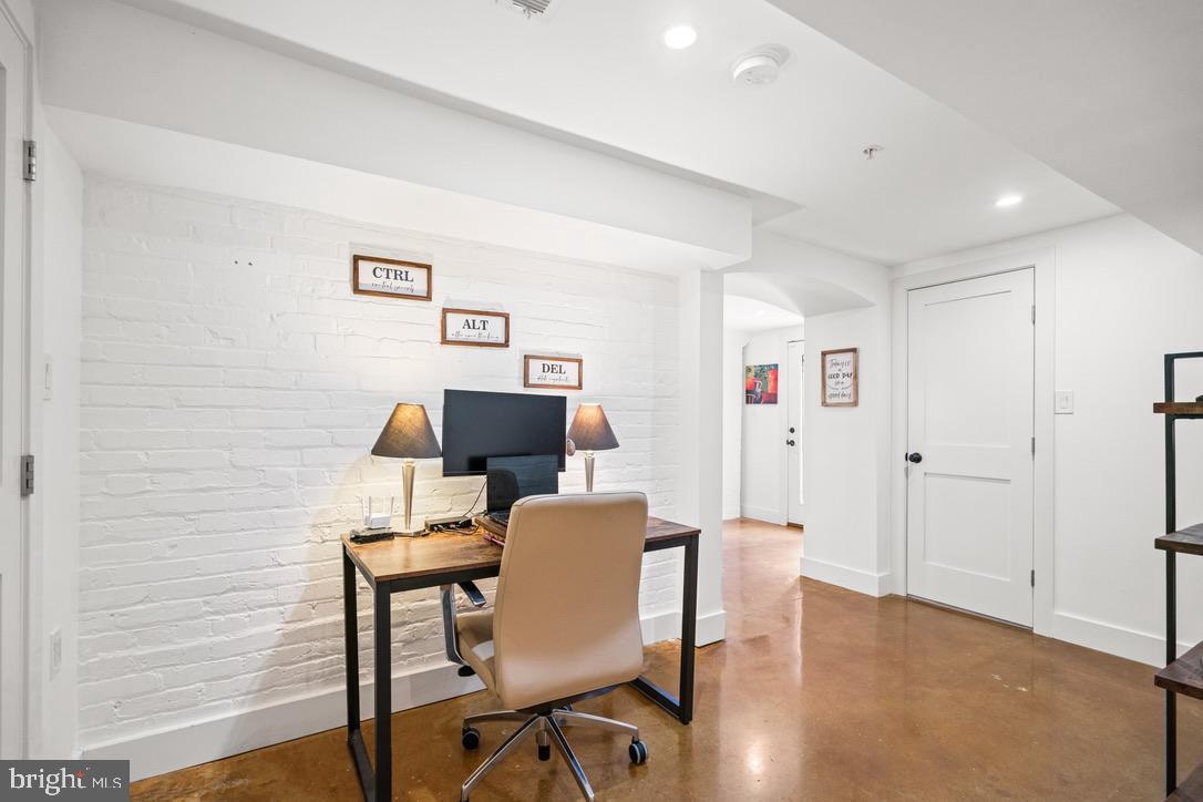 1239 Simms Place Northeast, Unit 5 Washington, DC 20002 - Photo 17 of 31 a workspace with furniture and wooden floor