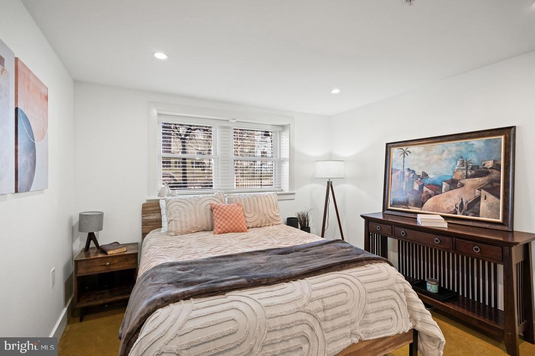 1239 Simms Place Northeast, Unit 5 Washington, DC 20002 - Photo 24 of 31 a bedroom with a large bed and a window