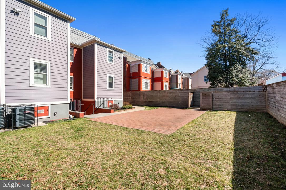 1239 Simms Place Northeast, Unit 5 Washington, DC 20002 - Photo 28 of 31 a front view of a house with a yard