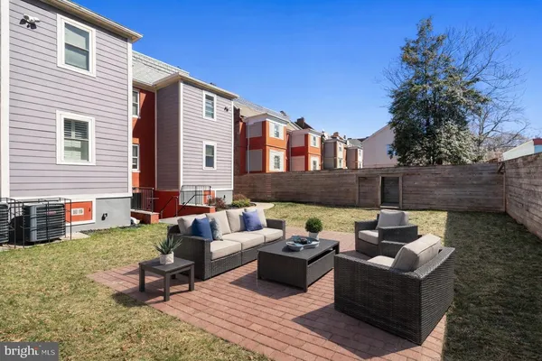 a outdoor living space with patio furniture and a potted plant