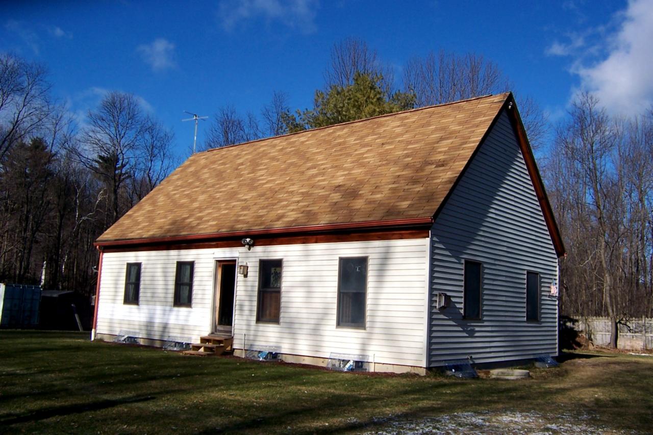 140 West Center Road West Stockbridge, MA 01266 - Photo 1 of 8 a front view of a house with a yard