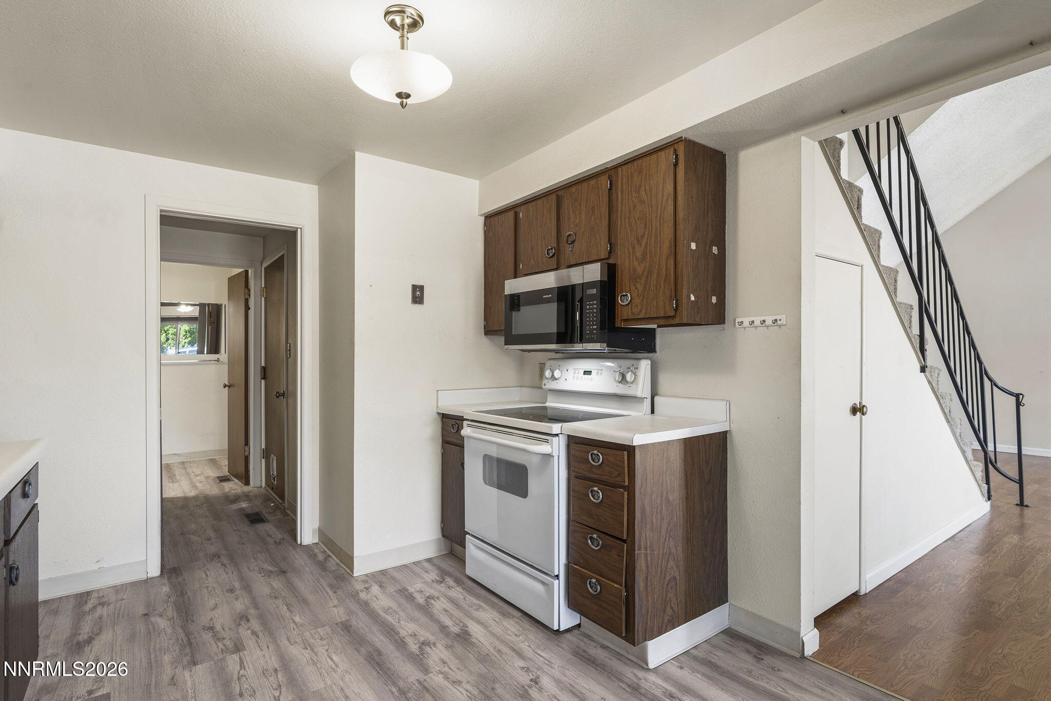 2153 Oppio Street Sparks, NV 89431 - Photo 12 of 23 a view of kitchen with sink microwave and refrigerator