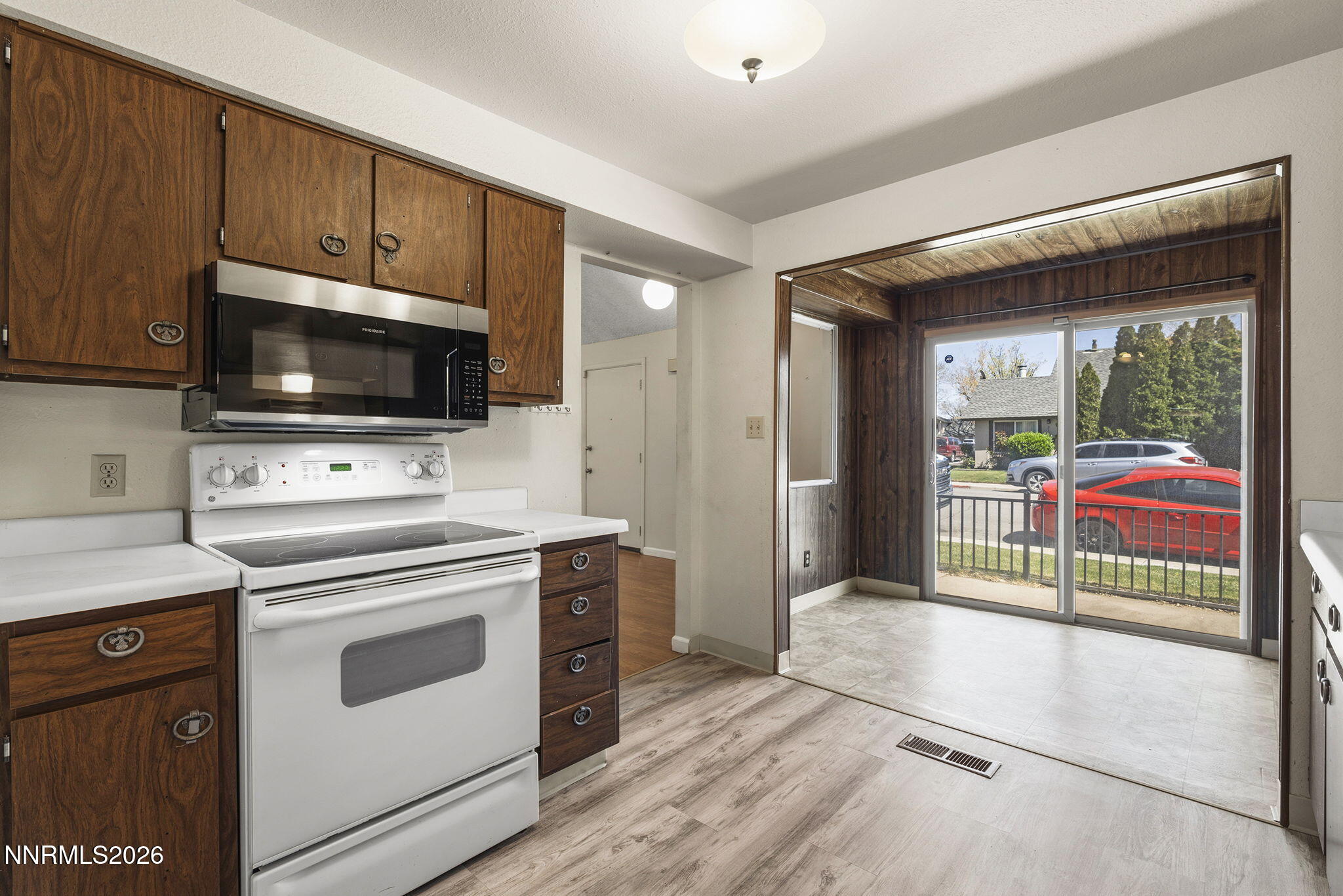 2153 Oppio Street Sparks, NV 89431 - Photo 14 of 23 a kitchen with a stove and a microwave