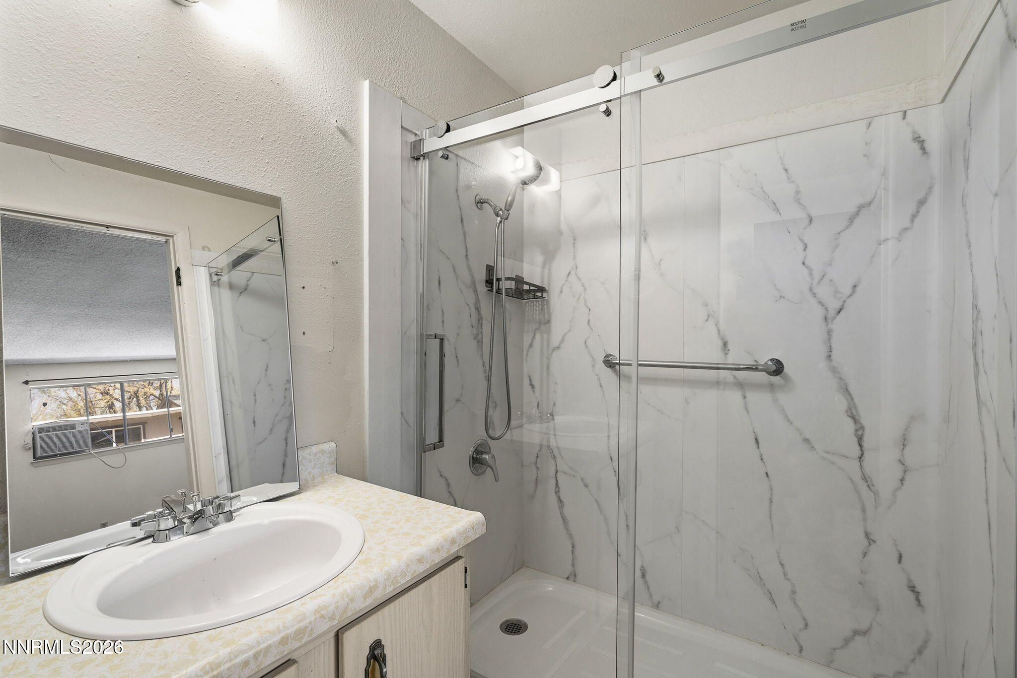 2153 Oppio Street Sparks, NV 89431 - Photo 19 of 23 a bathroom with a sink toilet and shower