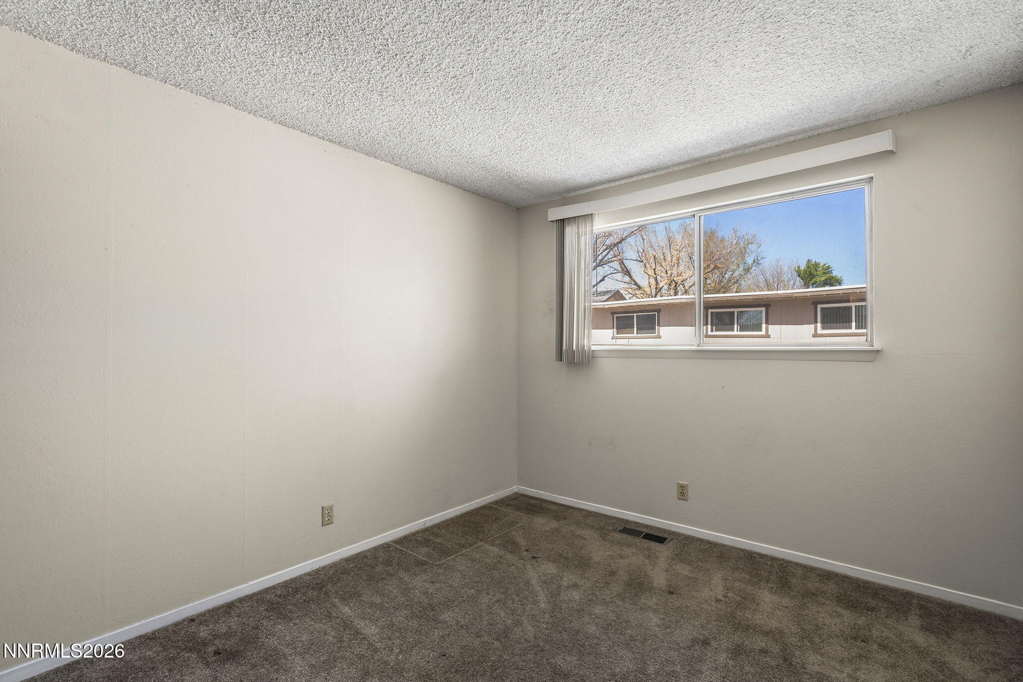 2153 Oppio Street Sparks, NV 89431 - Photo 20 of 23 an empty room with windows