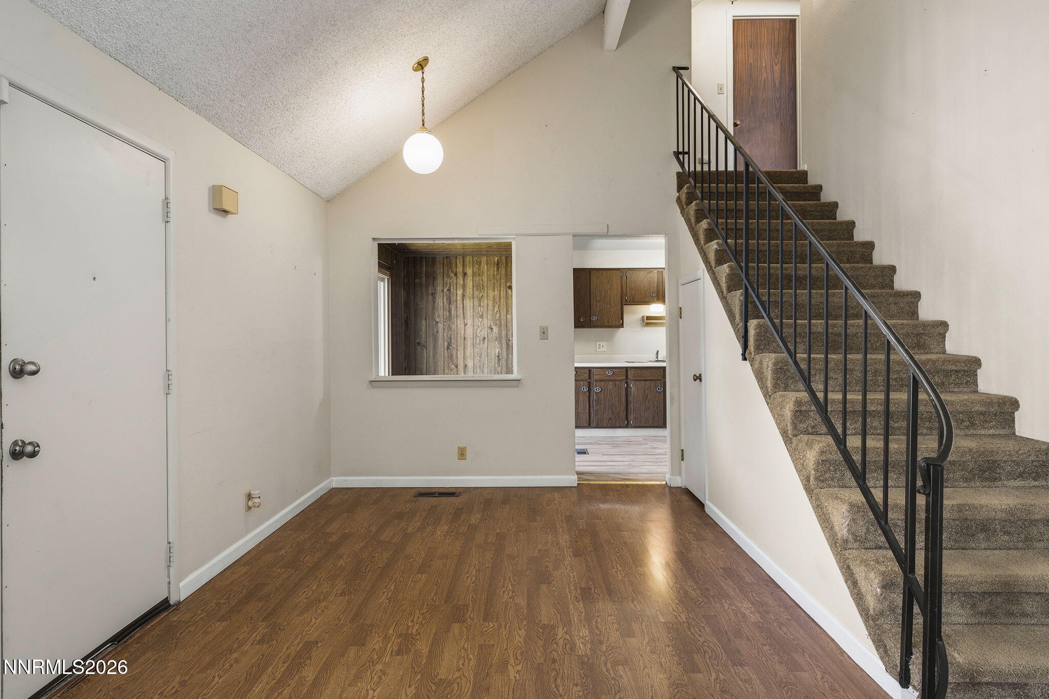 2153 Oppio Street Sparks, NV 89431 - Photo 9 of 23 a view of a livingroom with wooden floor and staircase