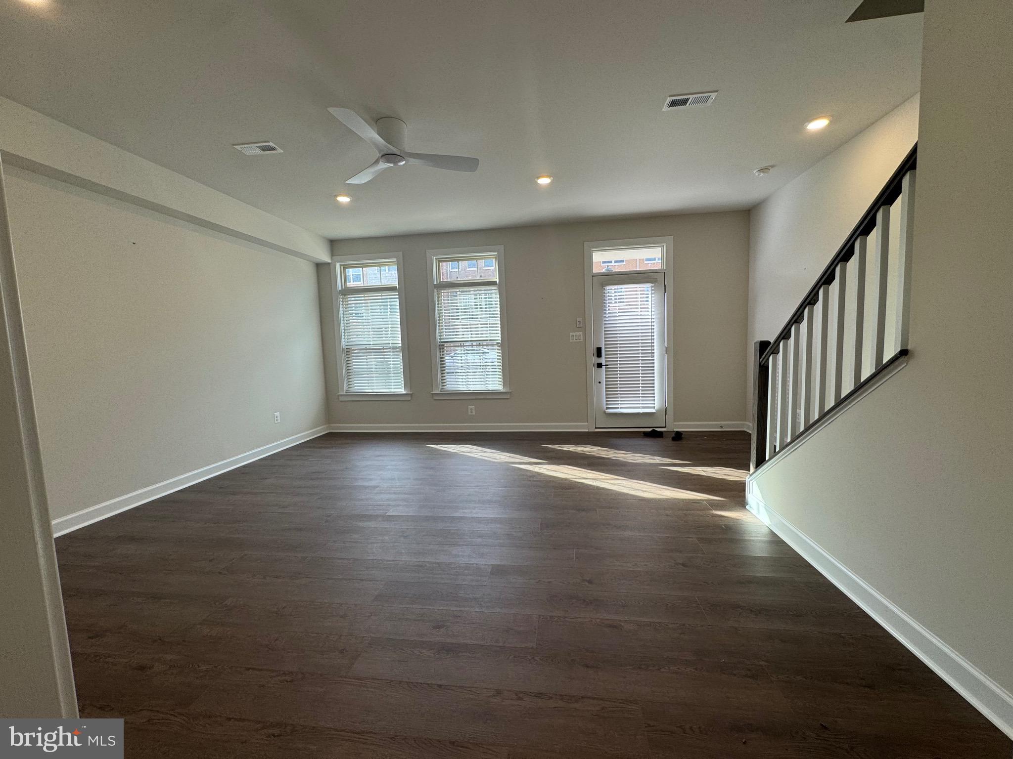 3775 Mayors Way Fairfax, VA 22030 - Photo 11 of 42 an empty room with wooden floor and windows