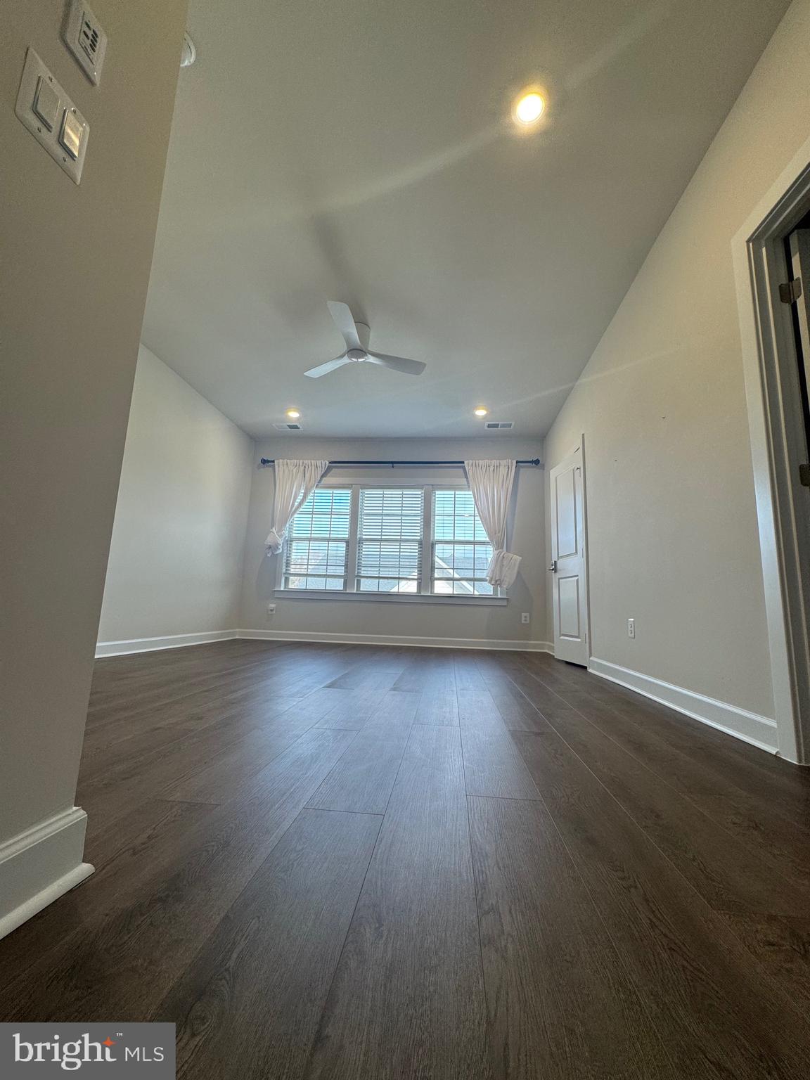 3775 Mayors Way Fairfax, VA 22030 - Photo 12 of 42 an empty room with wooden floor and windows