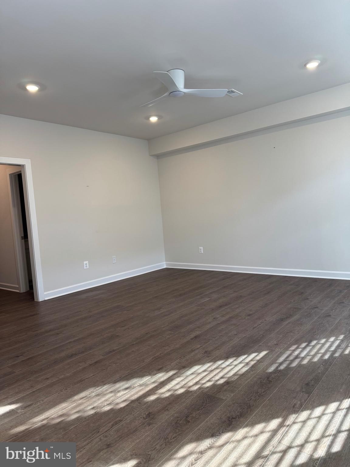 3775 Mayors Way Fairfax, VA 22030 - Photo 2 of 42 a view of an empty room with wooden floor and a window
