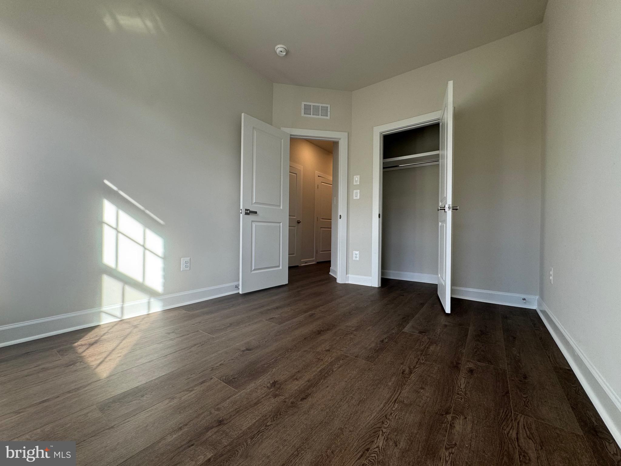 3775 Mayors Way Fairfax, VA 22030 - Photo 25 of 42 a view of an empty room with window and wooden floor