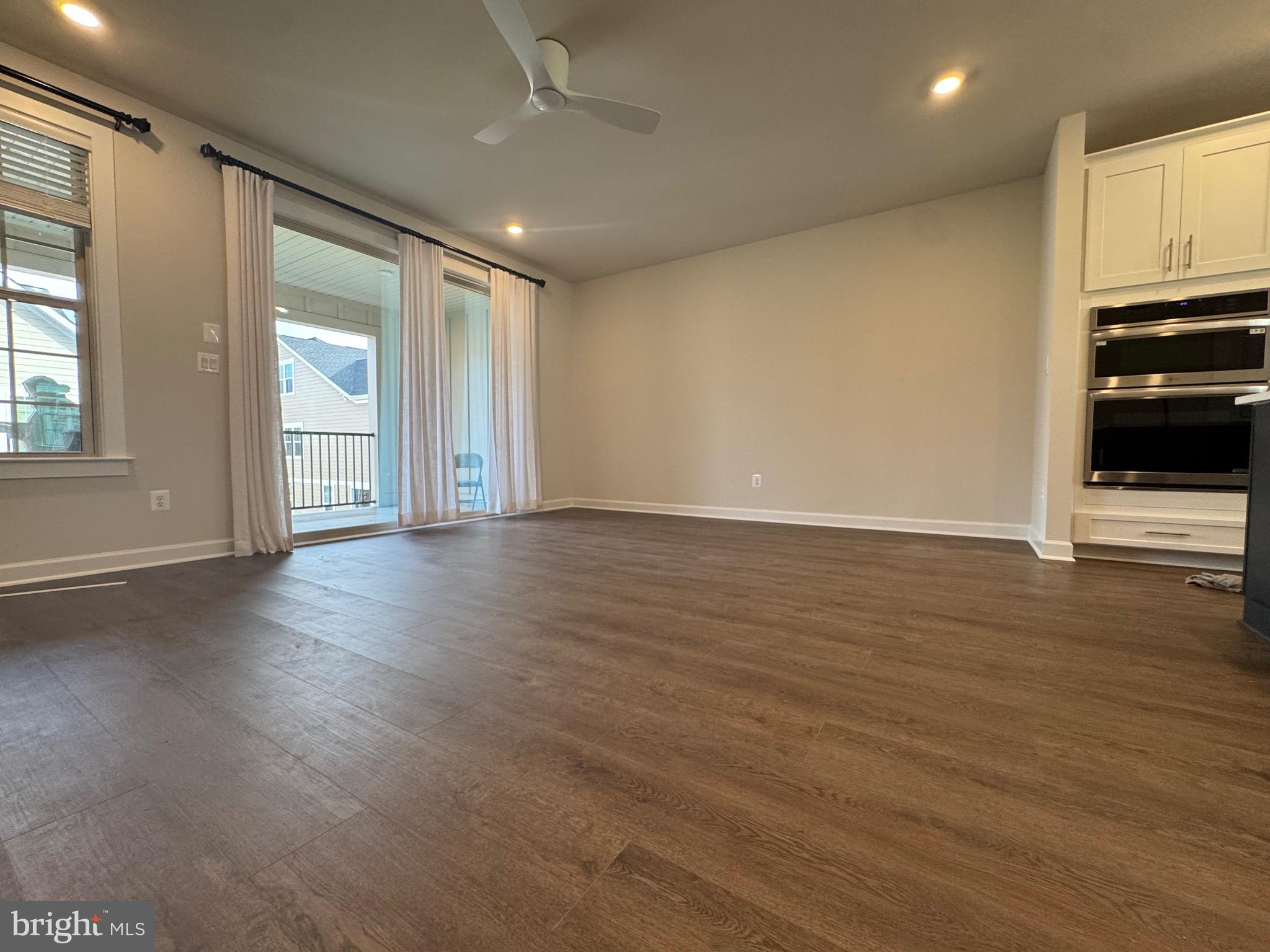 3775 Mayors Way Fairfax, VA 22030 - Photo 36 of 42 an empty room with wooden floor and windows