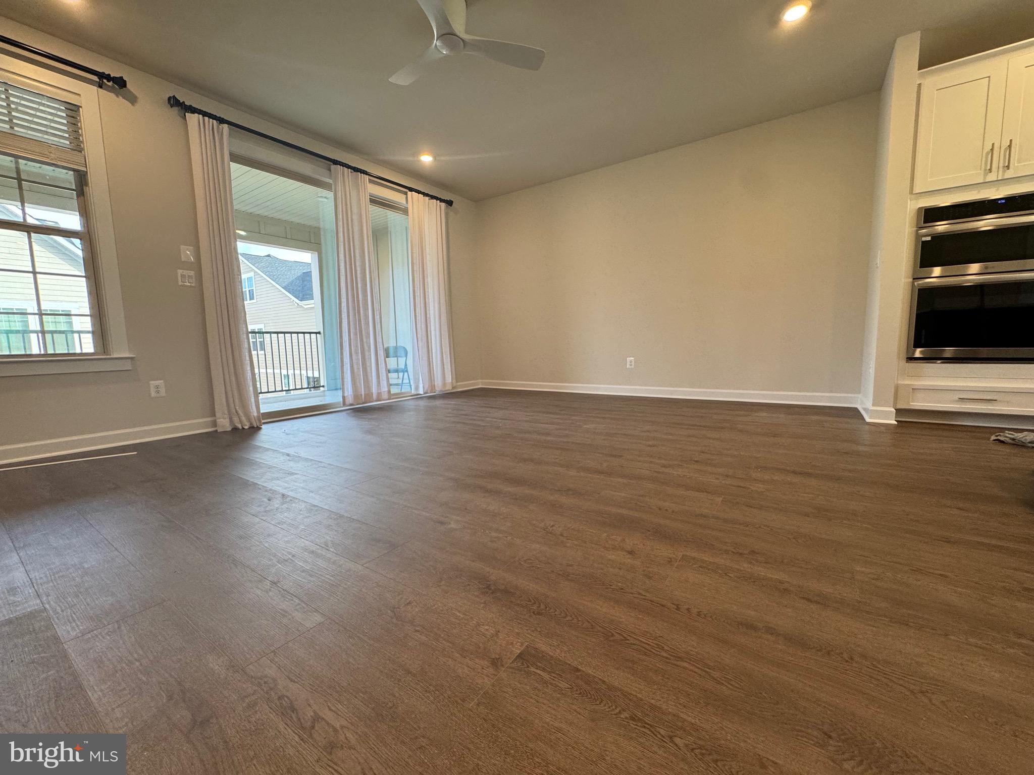 3775 Mayors Way Fairfax, VA 22030 - Photo 37 of 42 an empty room with wooden floor and windows
