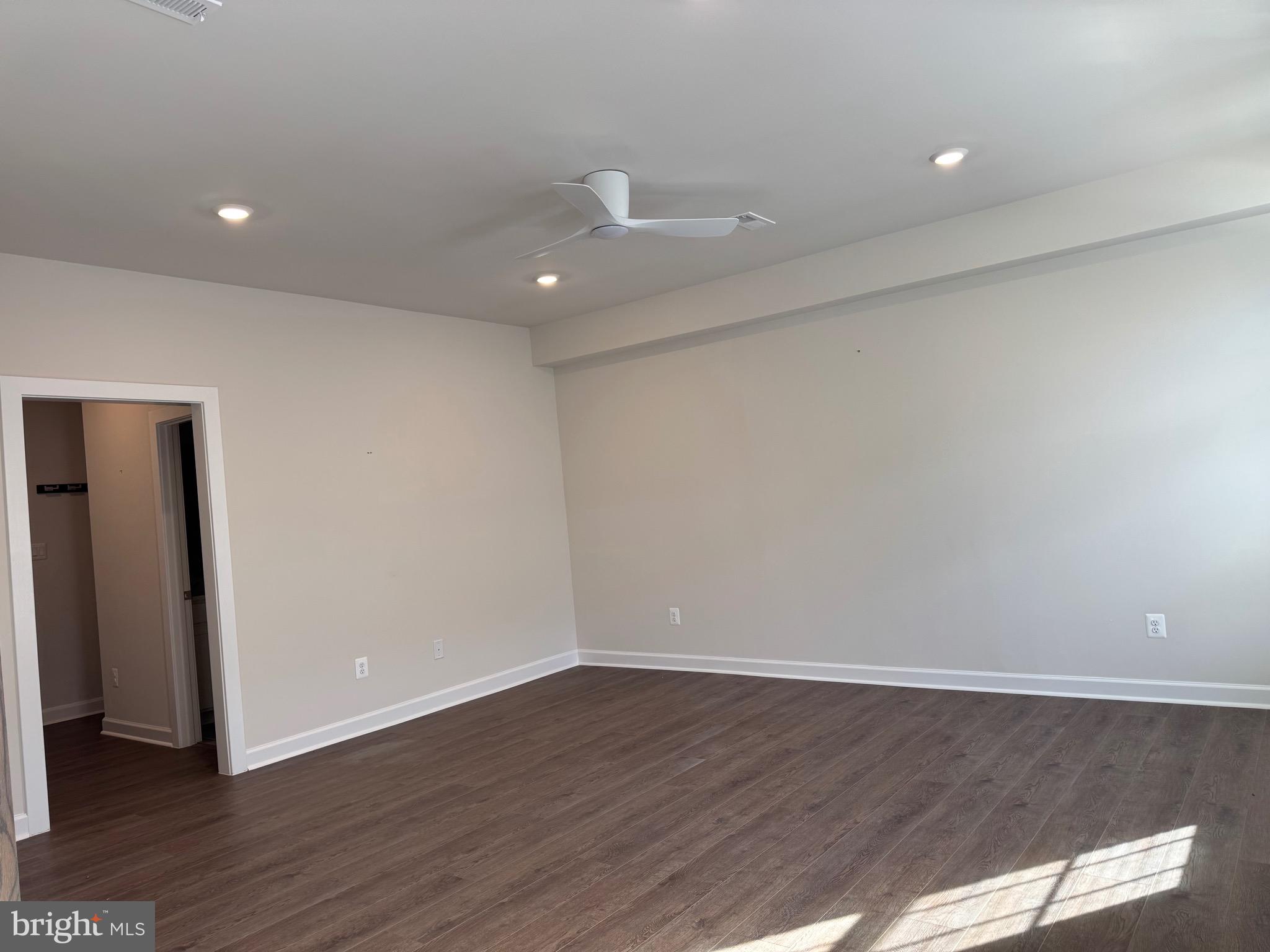 3775 Mayors Way Fairfax, VA 22030 - Photo 5 of 42 an empty room with wooden floor and windows