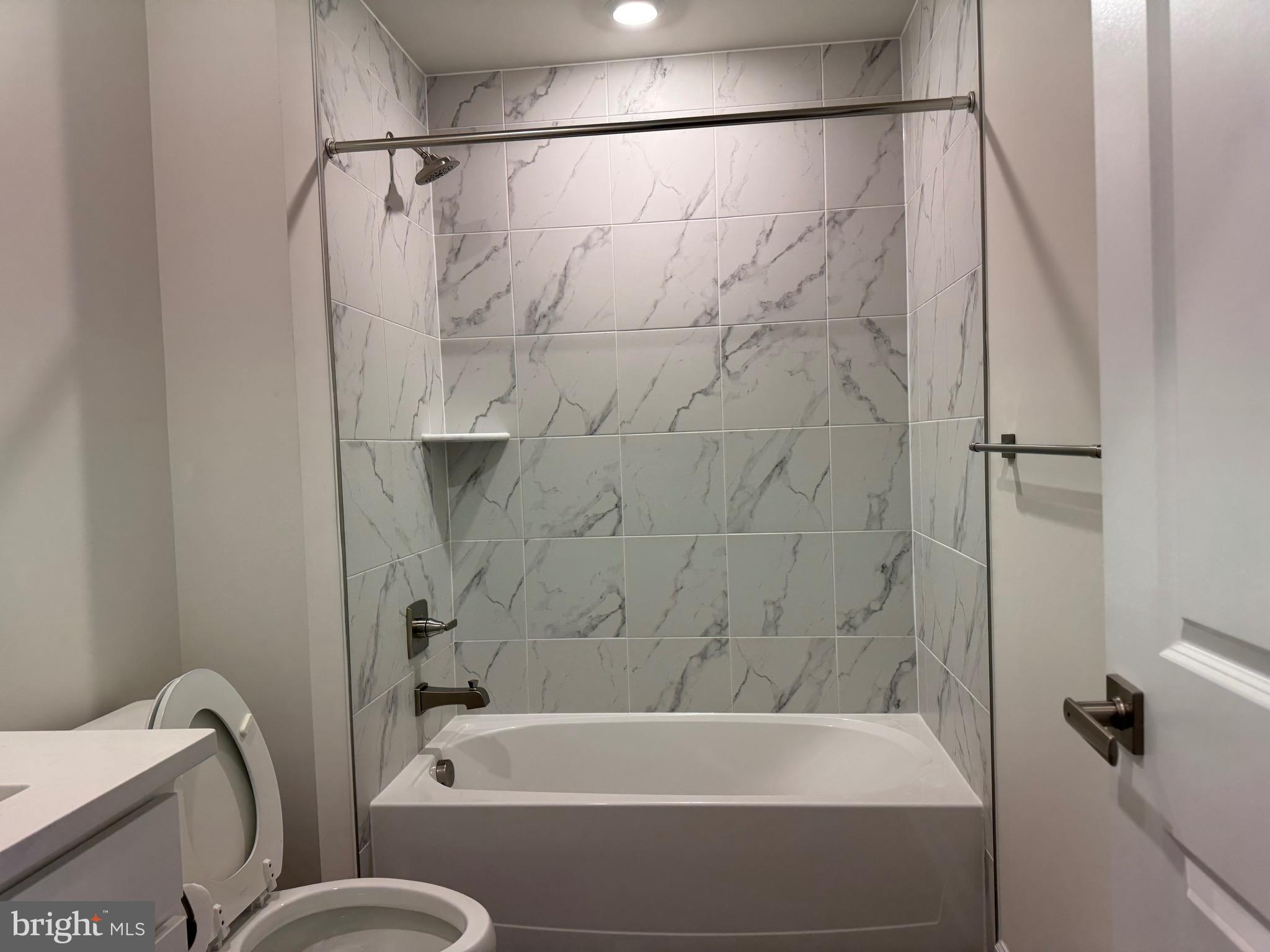 3775 Mayors Way Fairfax, VA 22030 - Photo 6 of 42 a bathroom with a bathtub and a shower