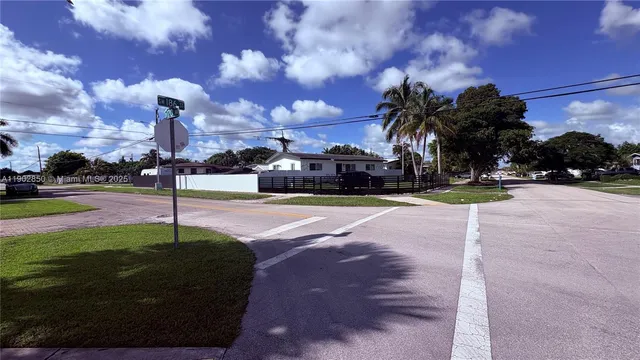 a view of a street with a building in the background