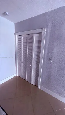 an empty room with a wooden door