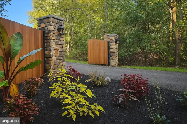 an aerial view of a swimming pool with a yard