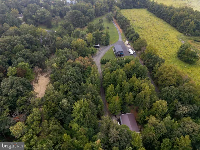 a aerial view of a house with a yard