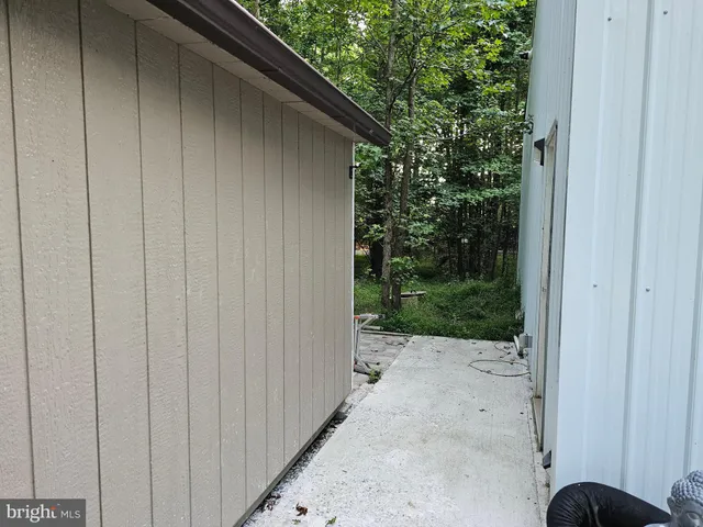 a view of a field with an trees in the background