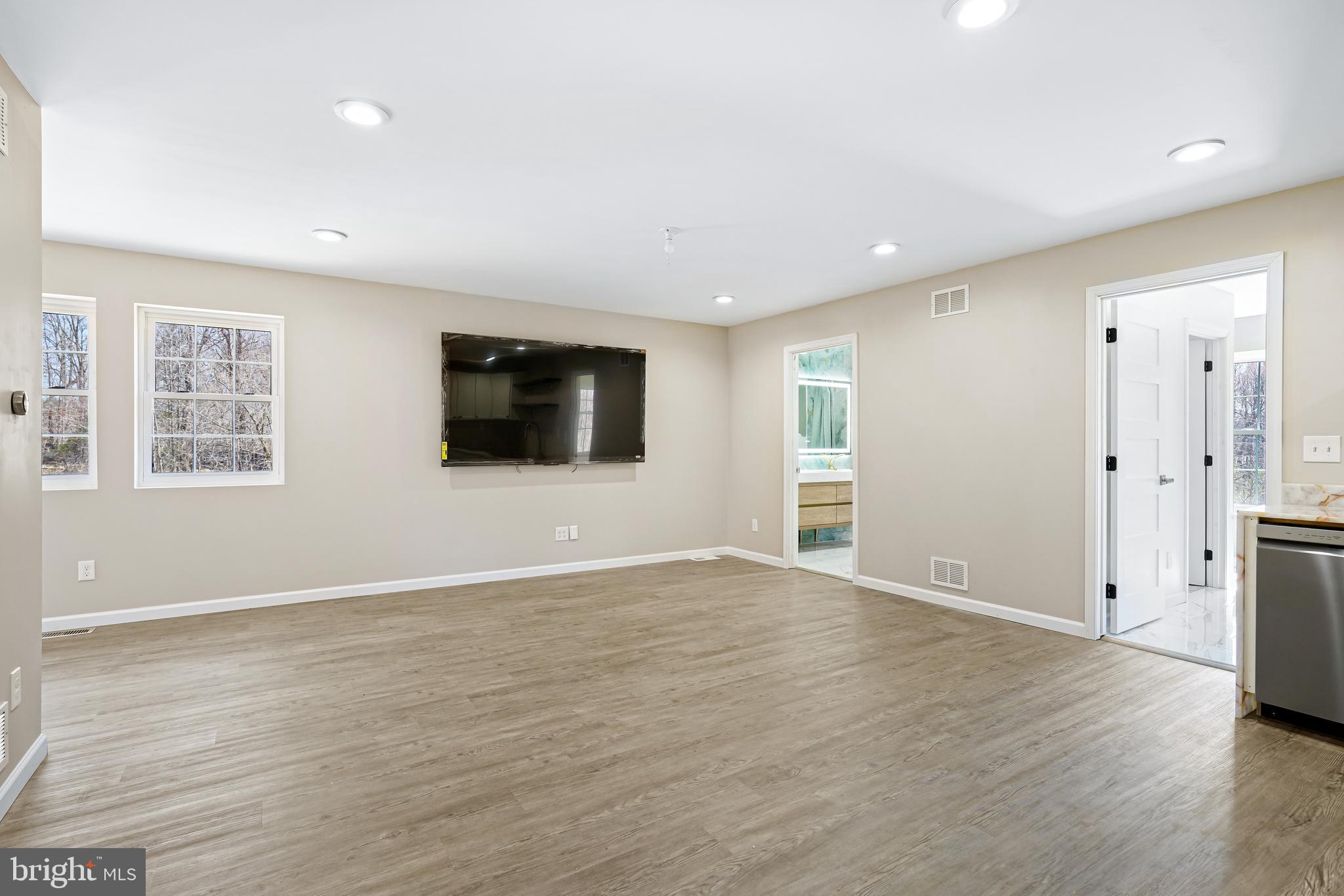 201 Johnstown Road Elkton, MD 21921 - Photo 49 of 84 a view of an empty room with wooden floor and windows
