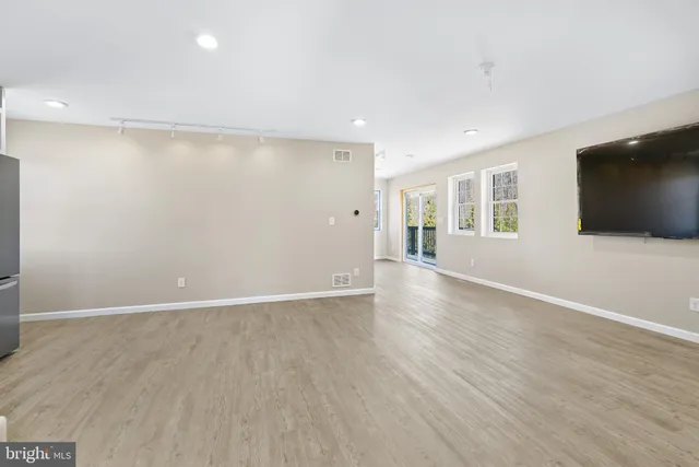 a room with gym equipment and a mirror