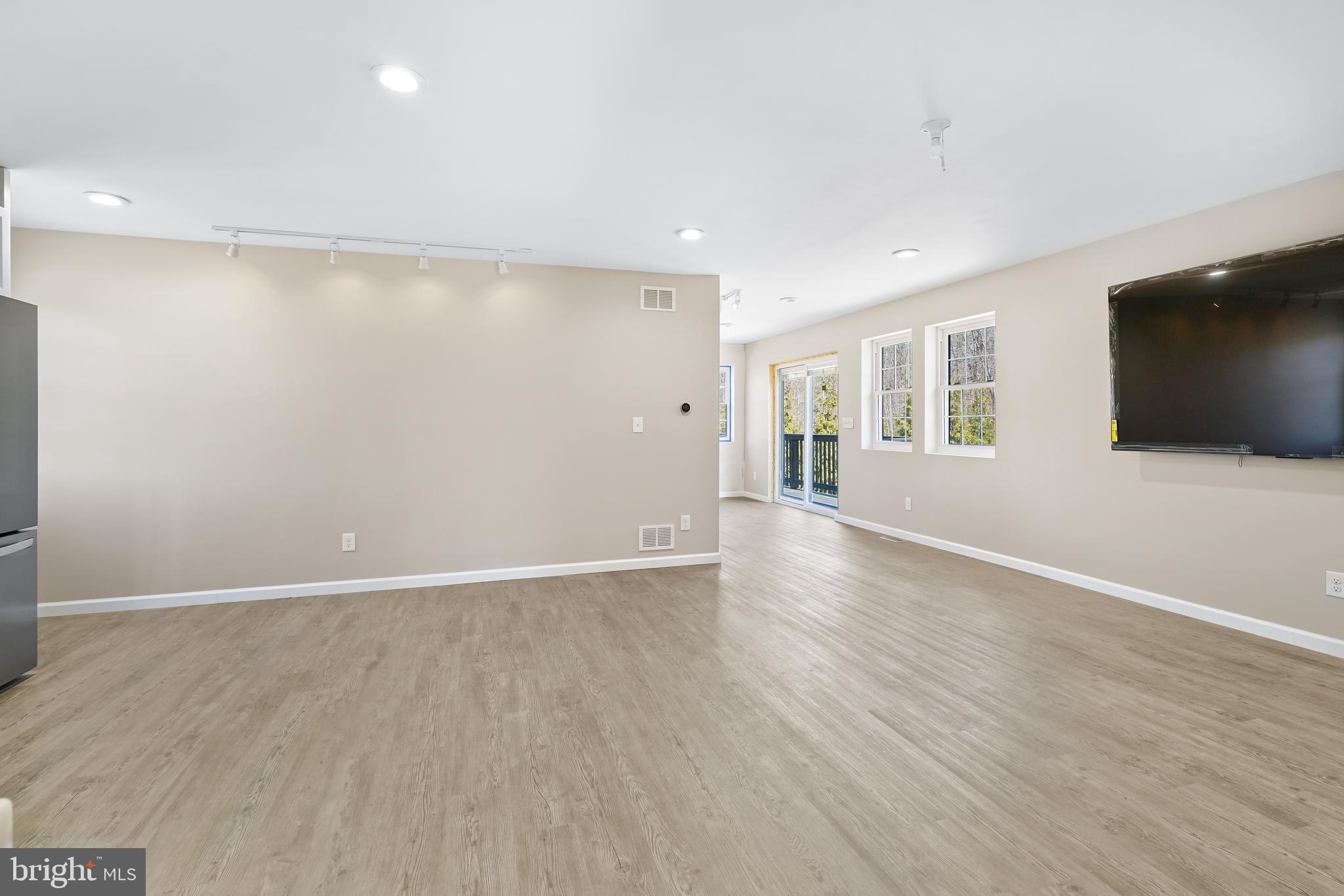 201 Johnstown Road Elkton, MD 21921 - Photo 50 of 84 a view of an empty room with wooden floor and a window