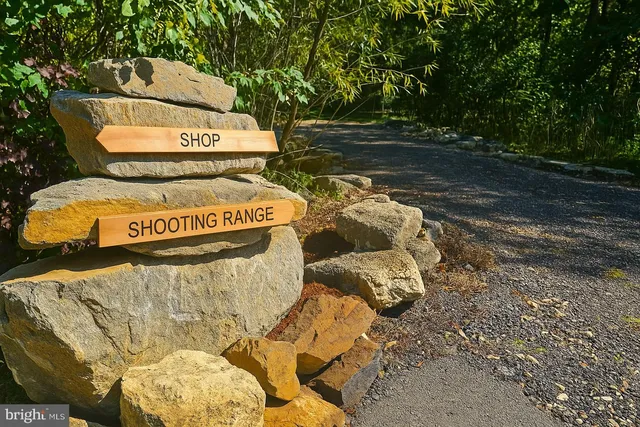 a kitchen with granite countertop a refrigerator stove and sink