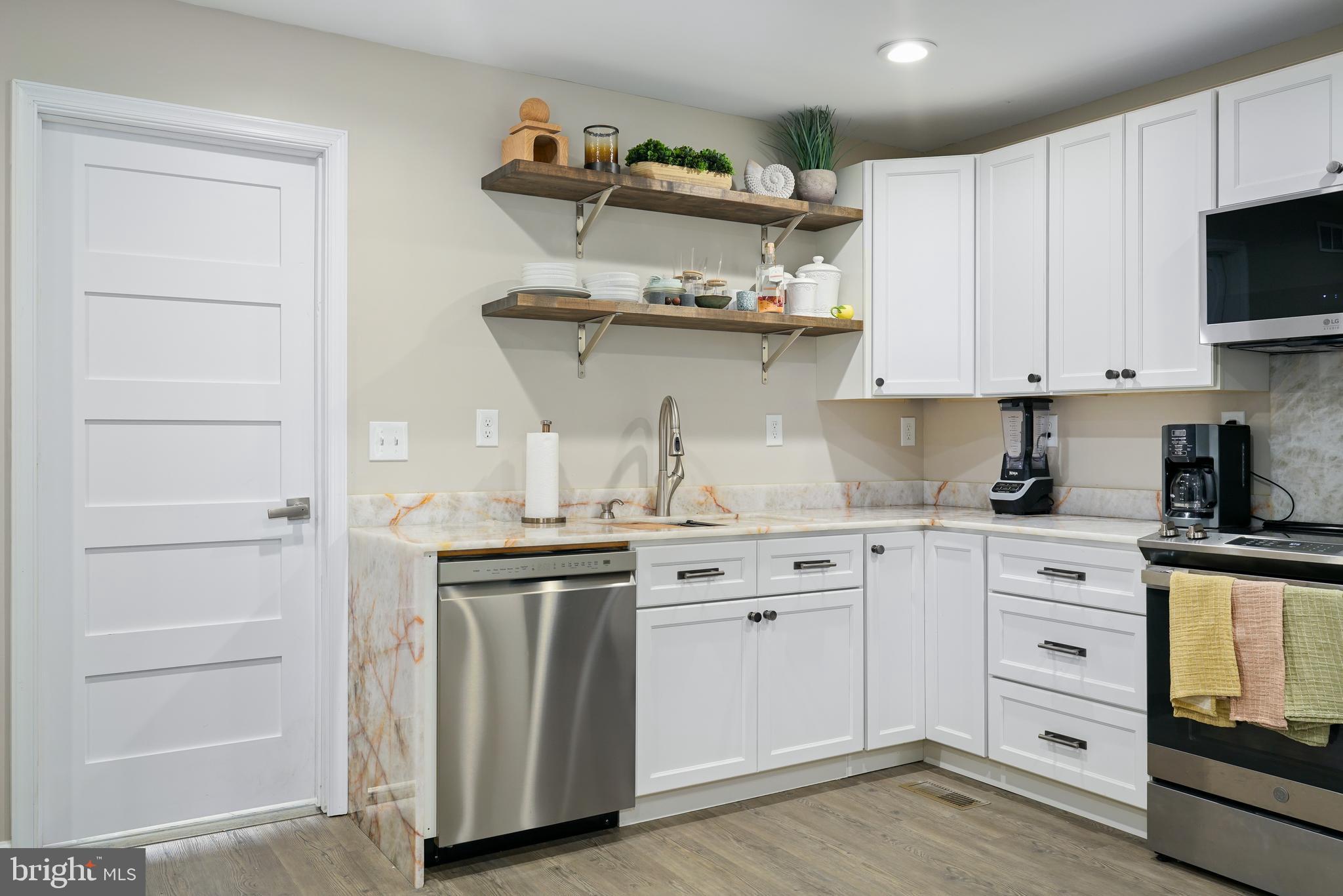 201 Johnstown Road Elkton, MD 21921 - Photo 7 of 84 a kitchen with stainless steel appliances granite countertop a sink and cabinets