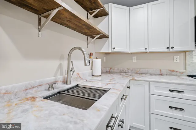 a bathroom with a shower and a sink