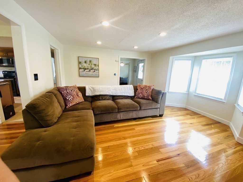 42 Sherwood Road Springfield, MA 01119 - Photo 5 of 34 a living room with a couch and a dining table
