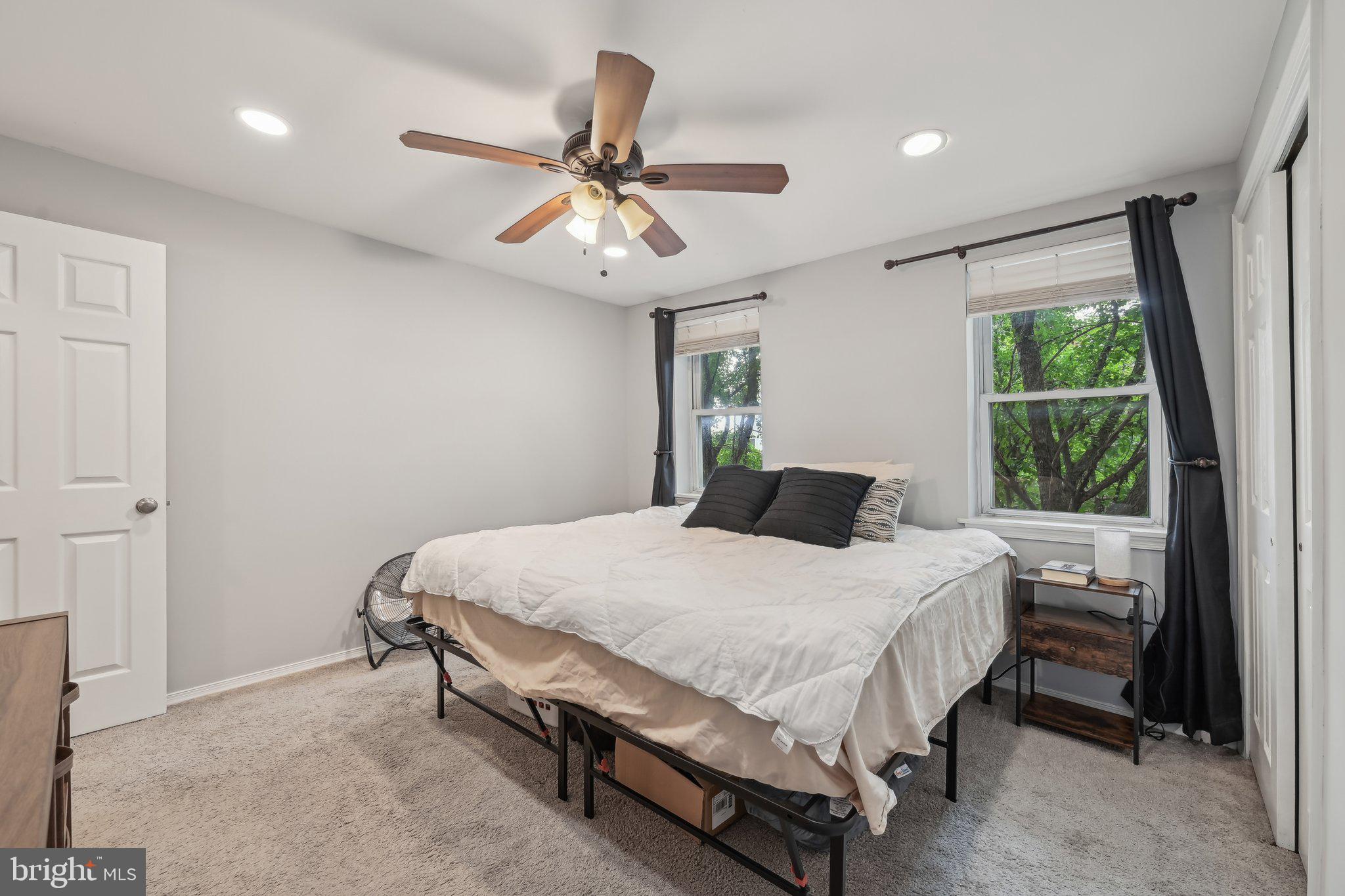 935 South Kenwood Avenue Baltimore, MD 21224 - Photo 11 of 25 a bedroom with a bed and a chandelier
