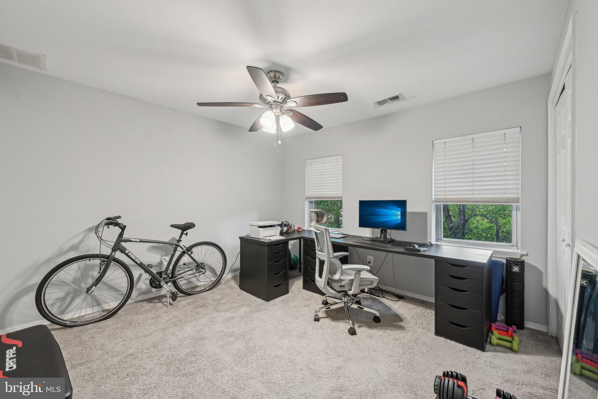 935 South Kenwood Avenue Baltimore, MD 21224 - Photo 18 of 25 a view of a workspace with furniture and a window