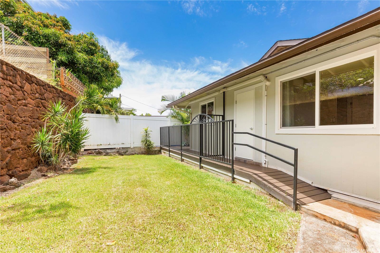 1898 Iwi Way Honolulu, HI 96816 - Photo 16 of 25 a view of a house with a backyard