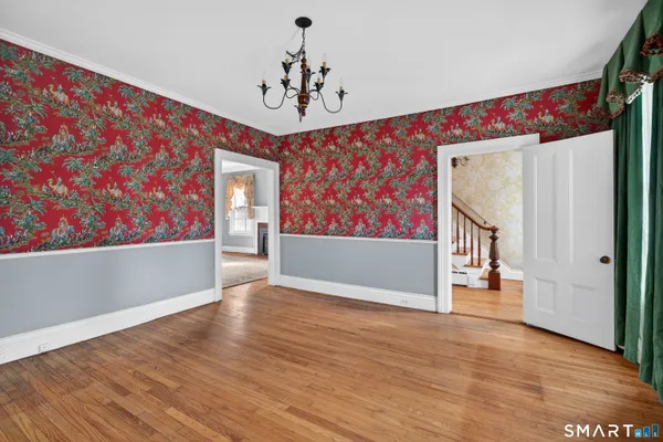 a view of an entryway with wooden floor