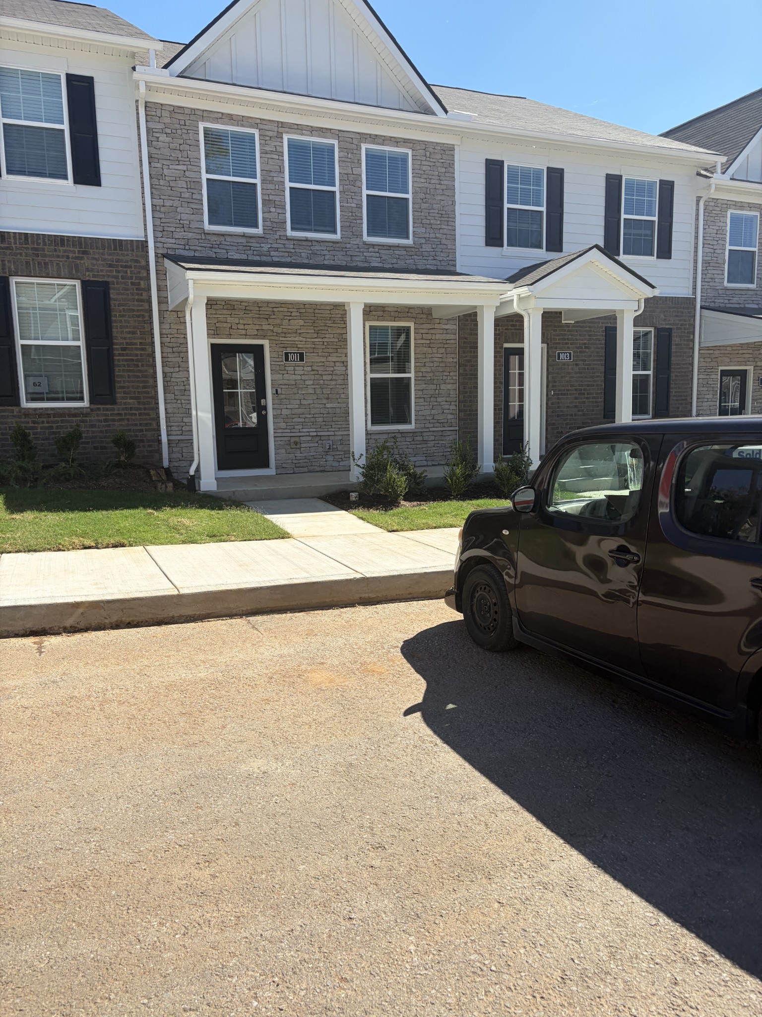 a car parked in front of a brick building