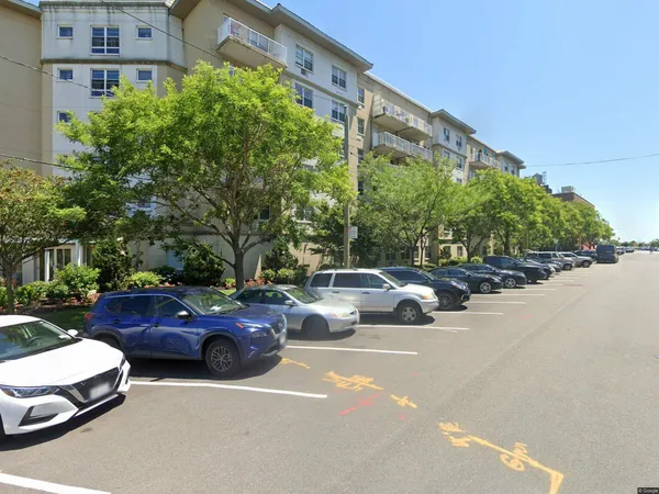 a view of a cars parked in front of a building