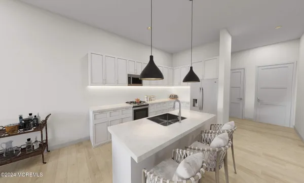 a kitchen that has a stove and a table