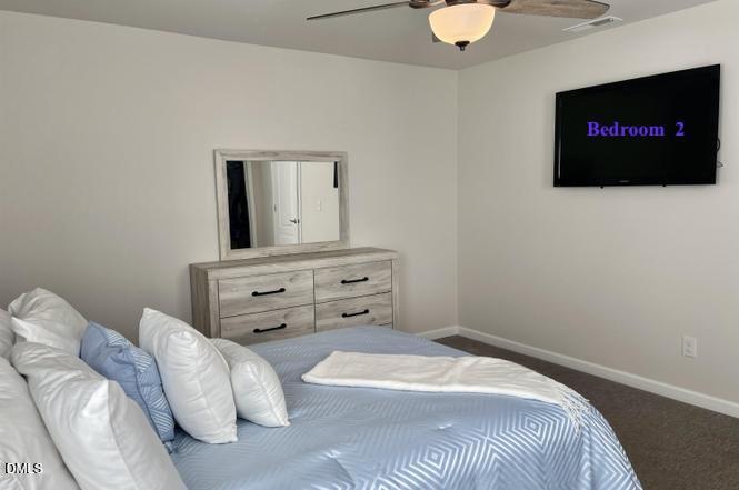 1807 Wrenn Road Durham, NC 27703 - Photo 33 of 43 a bedroom with a bed and a flat screen tv
