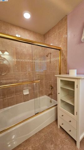 a bathroom with a shower and a bathtub