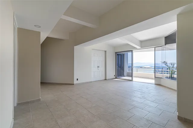 wooden floor and an empty room with a window