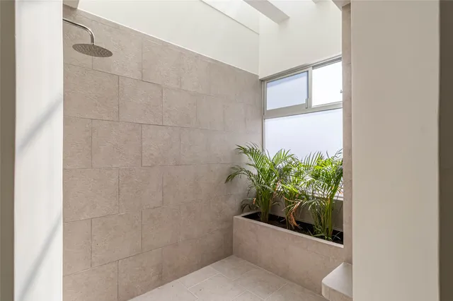 an aerial view of residential houses with yard