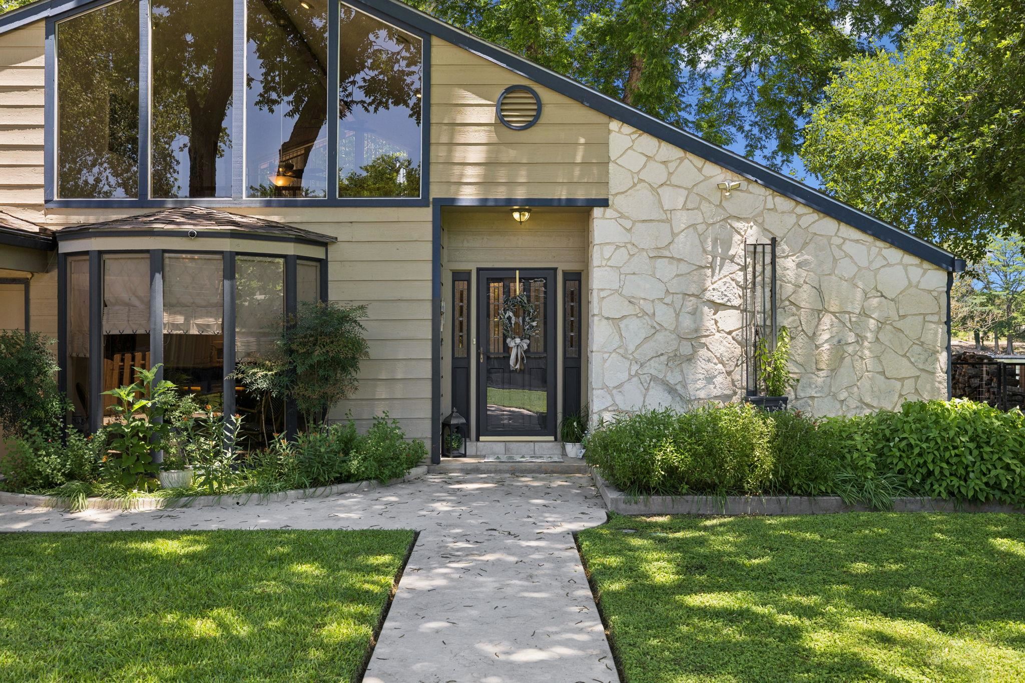 1435 East Zipp Road New Braunfels, TX 78130 - Photo 15 of 43 a front view of a house with garden