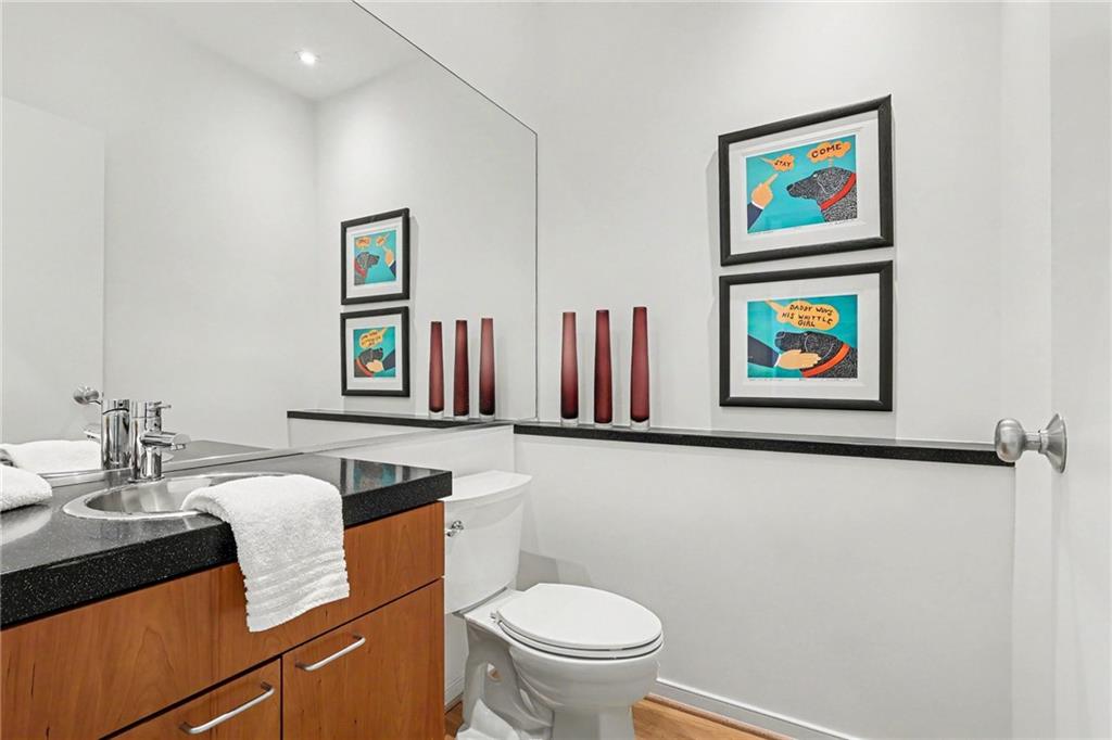 2465 Field Way Atlanta, GA 30319 - Photo 15 of 40 a bathroom with a toilet a sink and a mirror