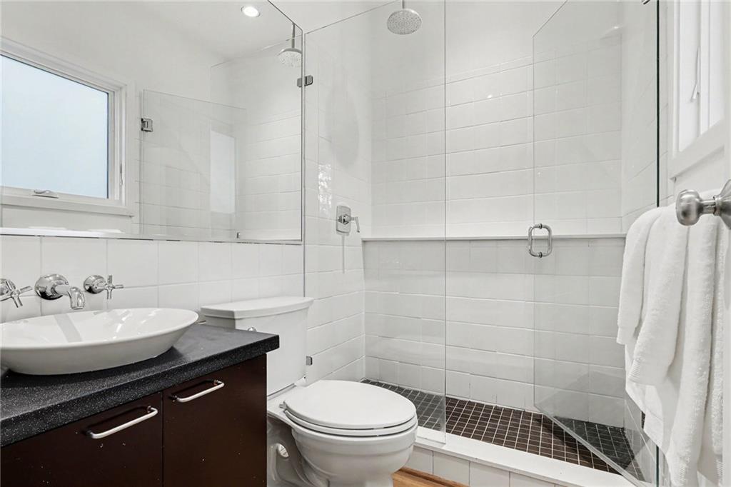 2465 Field Way Atlanta, GA 30319 - Photo 18 of 40 a bathroom with a sink a toilet and shower